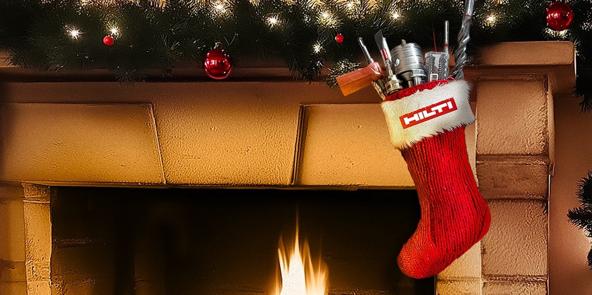 A festive fireplace scene with a Hilti stocking filled with tools